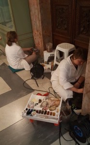 Vatican City Artisans painting and refurbishing a marble doorway.